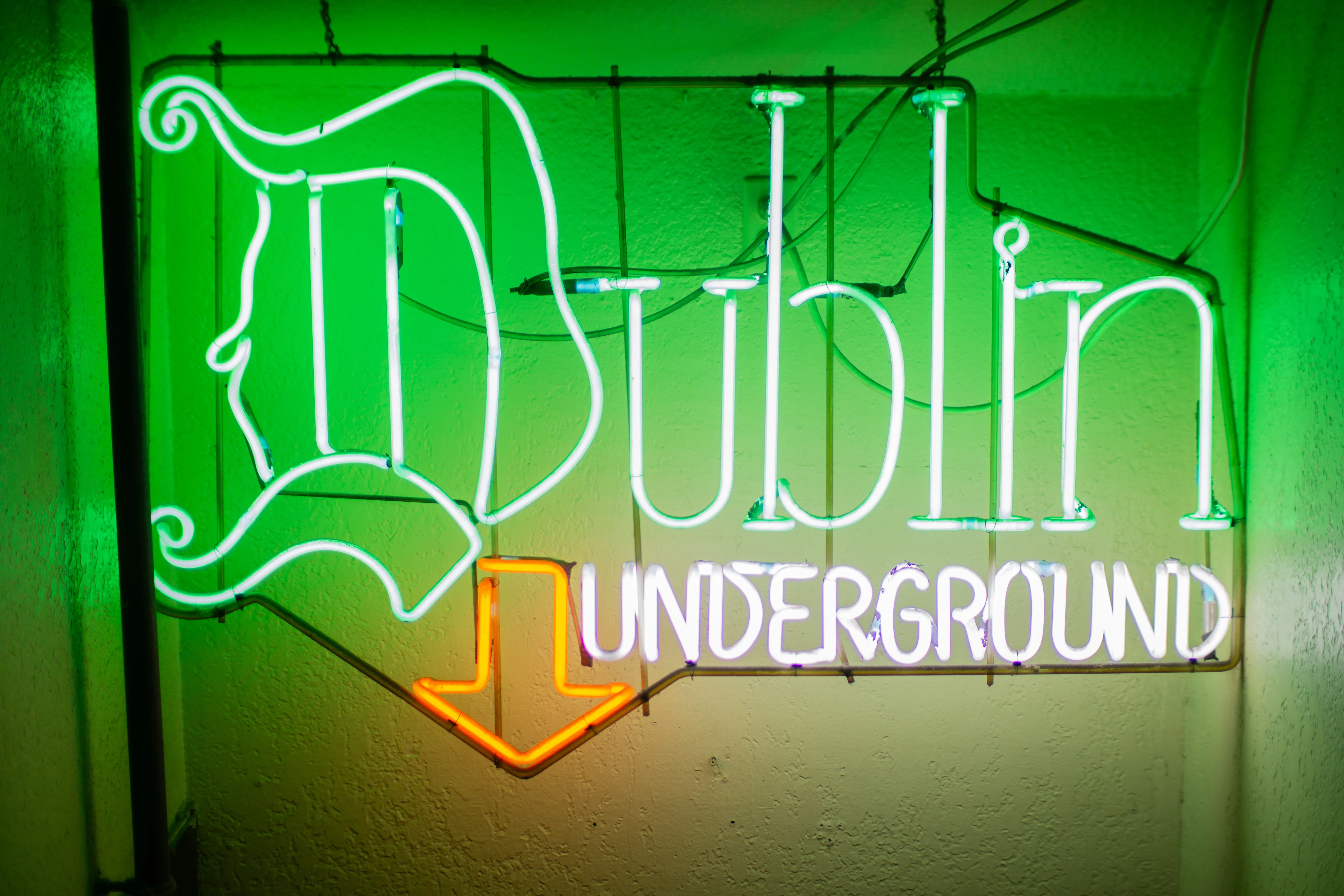 A neon sign reading "Dublin Underground."